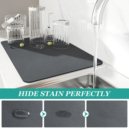Gray mat on a kitchen counter with glasses and a sink, emphasizing stain hiding capability.