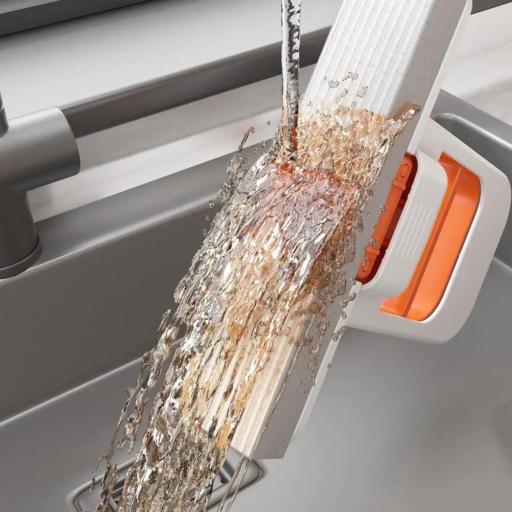 Mini mop squeezing water out over a sink, showing flexible squeegee edge.

