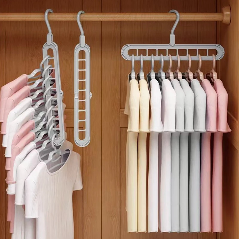 Space saving 9-hole clothes hanger organizers filled with shirts in a wooden wardrobe, 3 PCS pack.
