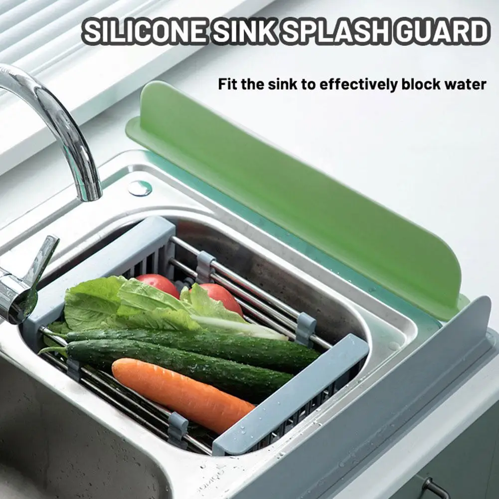 Silicone sink splash guard in use with vegetables in a sink