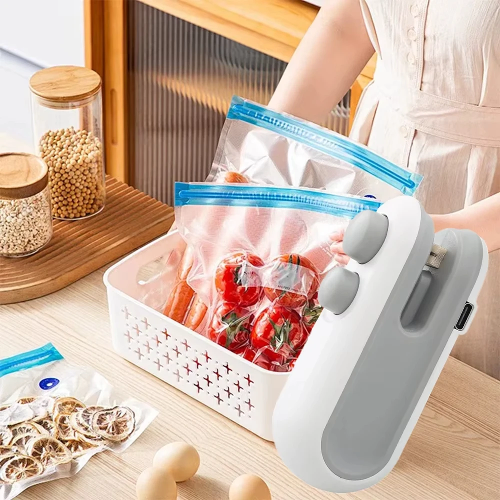 Person using a handheld vacuum sealer to seal food in a kitchen setting.