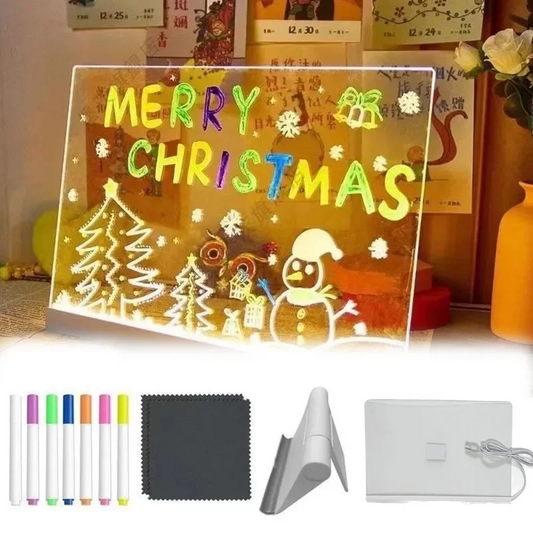 Christmas-themed LED sign with markers and cleaning cloth on a table.